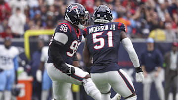 Dec 31, 2023; Houston, Texas, USA; Houston Texans defensive end Will Anderson Jr. (51) and defensive tackle Sheldon Rankins (98) react after a play during the game against the Tennessee Titans at NRG Stadium. Mandatory Credit: Troy Taormina-Imagn Images