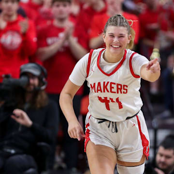 Kimberly High School's Raegan Krueger (44) points to a teammate after scoring a basket against Appleton East High School during a WIAA Division 1 state semifinal on Friday, March 14, 2025, at the Resch Center in Ashwaubenon, Wis. Kimberly won the game, 55-34.
Tork Mason/USA TODAY NETWORK-Wisconsin