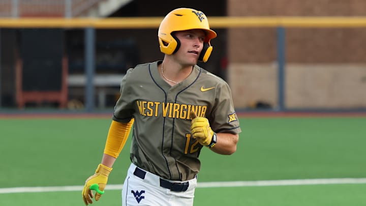 West Virginia junior Brodie Kresser rounds the bases after a grand slam in the first inning against Penn State.