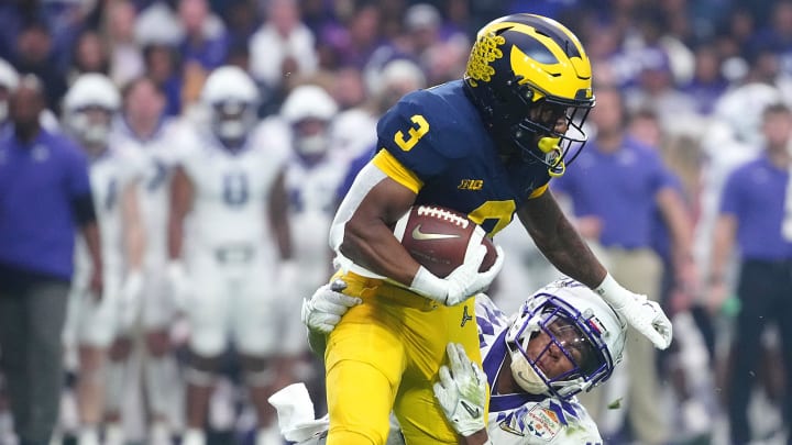 December 31, 2022; Glendale, Ariz; USA; TCU linebacker Dee Winters (13) tackles Michigan wide receiver AJ Henning (3) during the second half at State Farm Stadium.