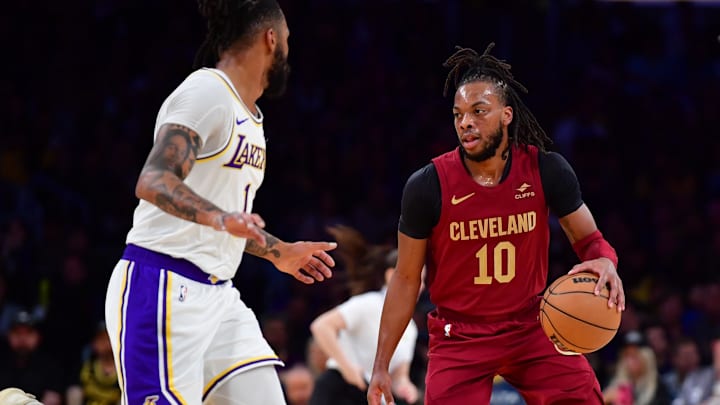 Apr 6, 2024; Los Angeles, California, USA;  Cleveland Cavaliers guard Darius Garland (10) moves the ball against Los Angeles Lakers guard D’Angelo Russell (1) during the first half at Crypto.com Arena. Mandatory Credit: Gary A. Vasquez-Imagn Images