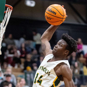 Reynolds's Rakease Passmore reaches to dunk the ball in the game against Roberson February 8, 2022.

Bbkh Tcrhs Vs Acrhs 02082022 0488