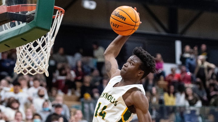 Reynolds's Rakease Passmore reaches to dunk the ball in the game against Roberson February 8, 2022.

Bbkh Tcrhs Vs Acrhs 02082022 0488