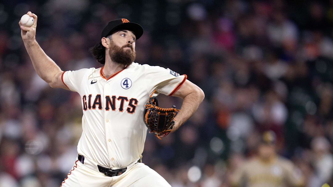 Jun 2, 2025; San Francisco, California, USA; San Francisco Giants pitcher Ryan Walker (74) delivers a pitch against the San Diego Padres during the tenth inning at Oracle Park. 