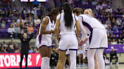 TCU players gather in a huddle versus Texas Tech.