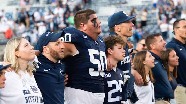 Penn State offensive lineman Cooper Cousins (50) joins the alma mater following a 46-11 win over Nevada, Saturday, August 30, 2025, in State College, Pa.