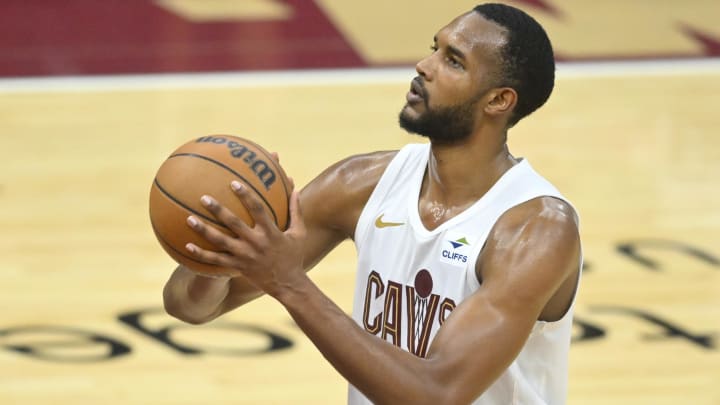 May 13, 2024; Cleveland, Ohio, USA; Cleveland Cavaliers forward Evan Mobley (4) attempts a free throw against the Boston Celtics in the third quarter of game four of the second round for the 2024 NBA playoffs at Rocket Mortgage FieldHouse.