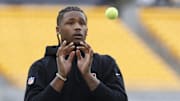 Dec 23, 2023; Pittsburgh, Pennsylvania, USA;  Cincinnati Bengals wide receiver Tee Higgins (5) warms up with tennis balls before the game against the Pittsburgh Steelers at Acrisure Stadium. Mandatory Credit: Charles LeClaire-Imagn Images