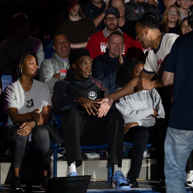 Recruit Sam Funches shares a moment with Gonzaga assistant coach Rjay Barsh