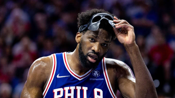 May 12, 2022; Philadelphia, Pennsylvania, USA; Philadelphia 76ers center Joel Embiid (21) removes his mask during a break in actin against the Miami Heat in the second quarter in game six of the second round of the 2022 NBA playoffs at Wells Fargo Center. Mandatory Credit: Bill Streicher-USA TODAY Sports