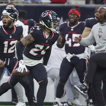 Dec 15, 2024; Houston, Texas, USA; Houston Texans cornerback Derek Stingley Jr. (24) reacts after an interception during the game against the Miami Dolphins at NRG Stadium. Mandatory Credit: Troy Taormina-Imagn Images