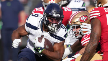 Dec 10, 2023; Santa Clara, California, USA; Seattle Seahawks running back Kenneth Walker III (9) carries the ball against San Francisco 49ers defensive end Nick Bosa (second from right) and linebacker Dre Greenlaw (far right) during the first quarter at Levi's Stadium. Mandatory Credit: Darren Yamashita-USA TODAY Sports