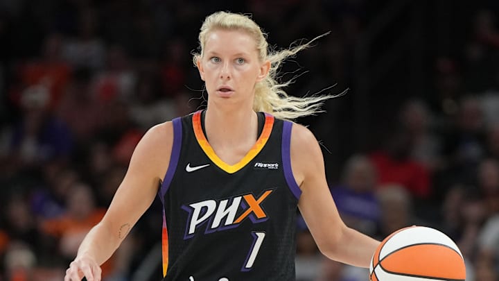 Jul 23, 2025; Phoenix, Arizona, USA; Phoenix Mercury guard Lexi Held (1) drives against the Atlanta Dream in the second half at Footprint Center. Mandatory Credit: Rick Scuteri-Imagn Images