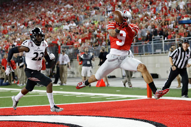 Ohio State Buckeyes wide receiver Devin Smith catches a touchdown pass behind Cincinnati Bearcats safety Zach Edwards.