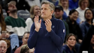 Mar 19, 2024; Minneapolis, Minnesota, USA; Minnesota Timberwolves head coach Chris Finch applauds his team as they play the Denver Nuggets in the first quarter at Target Center. Mandatory Credit: Bruce Kluckhohn-Imagn Images