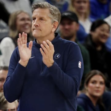 Mar 19, 2024; Minneapolis, Minnesota, USA; Minnesota Timberwolves head coach Chris Finch applauds his team as they play the Denver Nuggets in the first quarter at Target Center. Mandatory Credit: Bruce Kluckhohn-USA TODAY Sports
