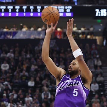 Dec 18, 2023; Salt Lake City, Utah, USA; Utah Jazz guard Talen Horton-Tucker (5) makes a three point shot against the Brooklyn Nets during the first quarter at Delta Center. Mandatory Credit: Rob Gray-Imagn Images