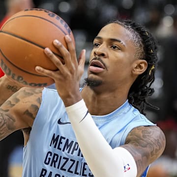 Dec 23, 2023; Atlanta, Georgia, USA; Memphis Grizzlies guard Ja Morant (12) warms up on the court prior to the game against the Atlanta Hawks at State Farm Arena. Mandatory Credit: Dale Zanine-Imagn Images