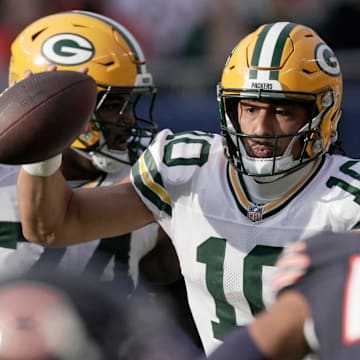Green Bay Packers quarterback Jordan Love (10) runs for a first down at the Chicago Bears last season.