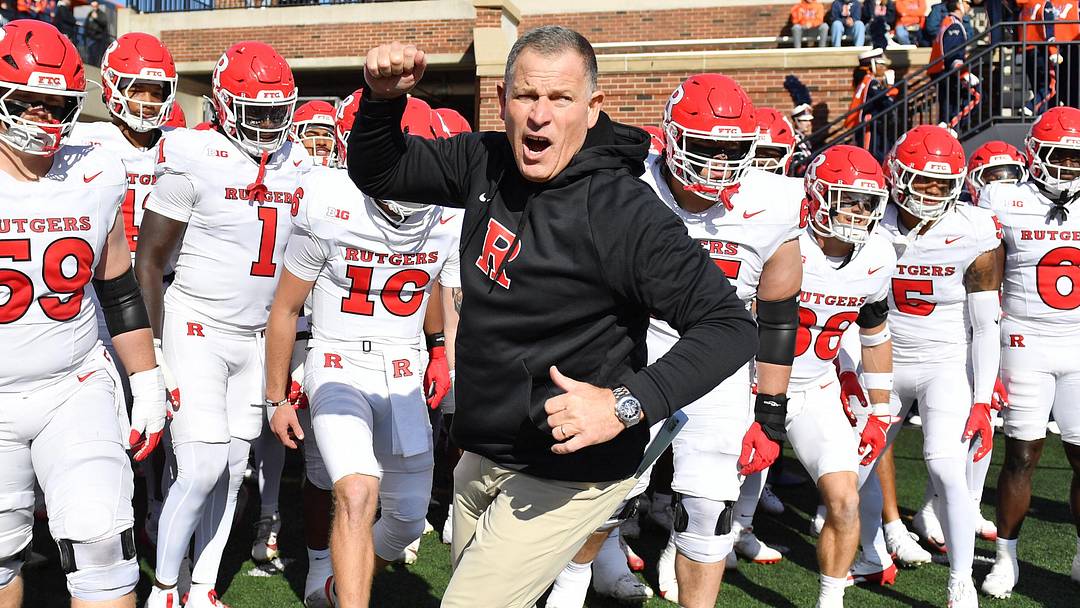 Nov 1, 2025; Champaign, Illinois, USA;  Rutgers Scarlet Knights head coach Greg Schiano takes the field against the Illinois Fighting Illini at Memorial Stadium. Mandatory Credit: Ron Johnson-Imagn Images