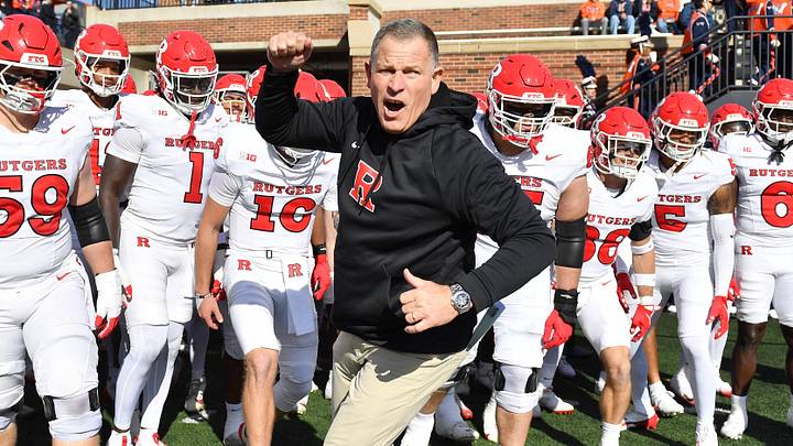 Nov 1, 2025; Champaign, Illinois, USA;  Rutgers Scarlet Knights head coach Greg Schiano takes the field against the Illinois Fighting Illini at Memorial Stadium. Mandatory Credit: Ron Johnson-Imagn Images