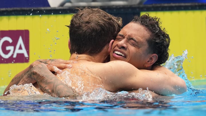 Carson Foster hugs Shaine Casas after the 200-meter individual medley final, Friday, June 21, 2024, during the seventh day of the U.S. Olympic Team Swimming Trials at Lucas Oil Stadium in Indianapolis.