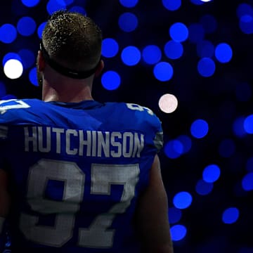 Sep 8, 2024; Detroit, Michigan, USA; Detroit Lions defensive end Aidan Hutchinson (97) is framed by the light show in the stands during a time out in the action against the Los Angeles Rams in the fourth quarter at Ford Field.