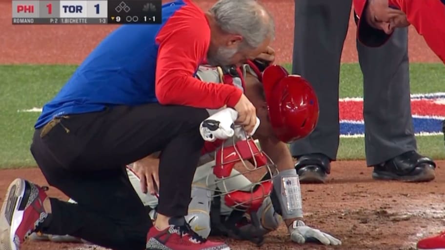 Philadelphia Phillies catcher J.T. Realmuto doubles over in pain from a pitch hitting him in the groin area. | John Foley/Screengrab