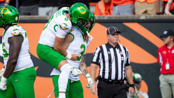 Oregon quarterback Dillon Gabriel celebrates a touchdown with Oregon tight end Terrance Ferguson as the Oregon State Beavers host the Oregon Ducks Saturday, Sept. 14, 2024 at Reser Stadium in Corvallis, Ore.