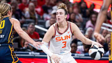 Connecticut Sun guard Marina Mabrey (3) dribbles the ball while Indiana Fever guard Lexie Hull (10) defends in the second half at Gainbridge Fieldhouse.