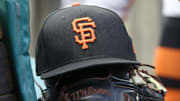 Jul 14, 2023; Pittsburgh, Pennsylvania, USA;  San Francisco Giants hat and glove on the bench against the Pittsburgh Pirates during the first inning at PNC Park. 