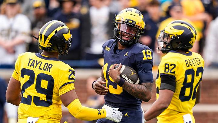 Team Blue Michigan quarterback Bryce Underwood (19) tries to run after recovering his fumble during the second half of the spring game at Michigan Stadium in Ann Arbor on Saturday, April 19, 2025.