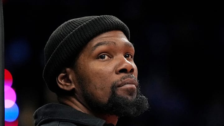 Nov 18, 2024; Phoenix, Arizona, USA; Phoenix Suns forward Kevin Durant (35) watches game action against the Orlando Magic during the second half of an NBA game at Footprint Center. Mandatory Credit: Rick Scuteri-Imagn Images