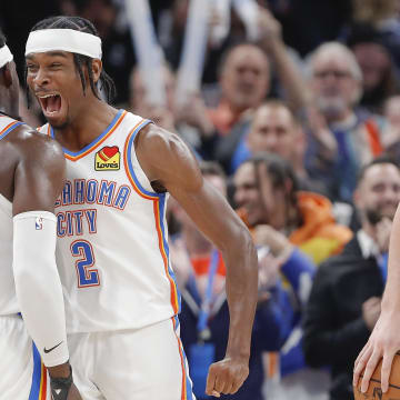 Dec 21, 2022; Oklahoma City, Oklahoma, USA; Oklahoma City Thunder guard Shai Gilgeous-Alexander (2) and Oklahoma City Thunder guard Luguentz Dort (5) celebrate at the end of their game against the Portland Trial Blazers at Paycom Center. Oklahoma City won 101-98. Mandatory Credit: Alonzo Adams-USA TODAY Sports