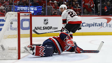 Oct 25, 2025; Washington, District of Columbia, USA; Ottawa Senators center Nick Cousins (21) scores a goal on Washington Capitals goaltender Charlie Lindgren (79) during the second period at Capital One Arena. Mandatory Credit: Geoff Burke-Imagn Images