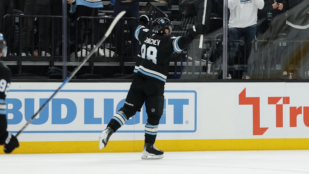 Dec 18, 2024; Salt Lake City, Utah, USA;  Utah Hockey Club defenseman Mikhail Sergachev (98) celebrates the winning overtime goal against the Vancouver Canucks at Delta Center. Mandatory Credit: Chris Nicoll-Imagn Images