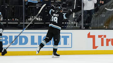 Dec 18, 2024; Salt Lake City, Utah, USA;  Utah Hockey Club defenseman Mikhail Sergachev (98) celebrates the winning overtime goal against the Vancouver Canucks at Delta Center. Mandatory Credit: Chris Nicoll-Imagn Images