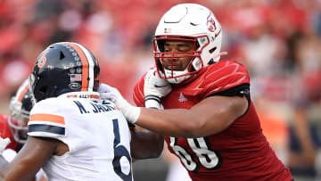 Oct 9, 2021; Louisville, Kentucky, USA;  Louisville Cardinals offensive lineman Michael Gonzalez (68) blocks Virginia Cavaliers inside linebacker Nick Jackson (6) during the second half at Cardinal Stadium.