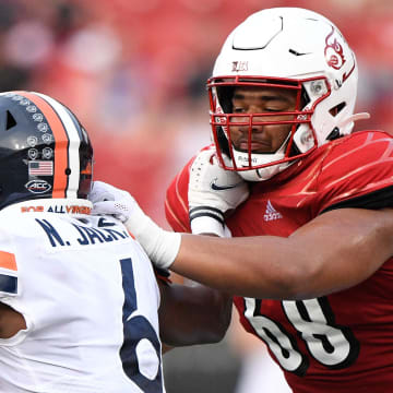 Oct 9, 2021; Louisville, Kentucky, USA;  Louisville Cardinals offensive lineman Michael Gonzalez (68) blocks Virginia Cavaliers inside linebacker Nick Jackson (6) during the second half at Cardinal Stadium.