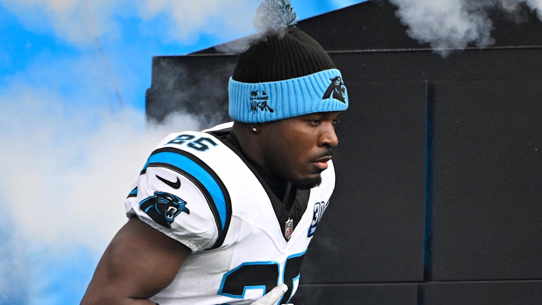 Carolina Panthers safety Xavier Woods runs on to the field before the game.