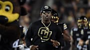 Oct 12, 2024; Boulder, Colorado, USA; Colorado Buffaloes head coach Deion Sanders runs onto the field with his team before the game against the Kansas State Wildcats at Folsom Field. Mandatory Credit: Christopher Hanewinckel-Imagn Images