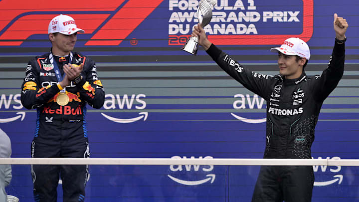 Jun 9, 2024; Montreal, Quebec, CAN;  Mercedes driver George Russell (GBR) reacts next to winner Red Bull Racing driver Max Verstappen (NED) after getting third place in the Canadian Grand Prix at Circuit Gilles Villeneuve. Mandatory Credit: Eric Bolte-Imagn Images