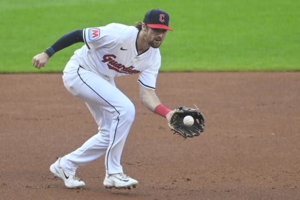 Daniel Schneemann fields a ball at third base 