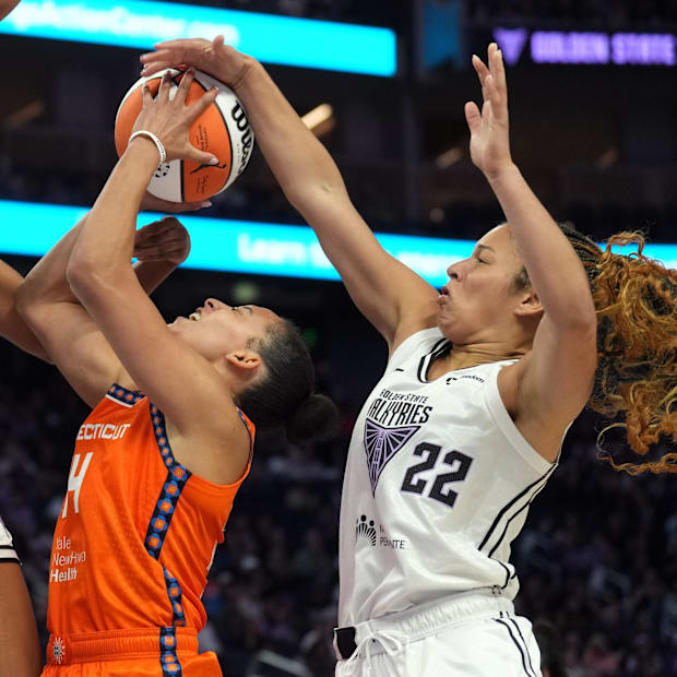 Golden State Valkyries guard Veronica Burton blocks a shot by Connecticut Sun guard Bria Hartley.