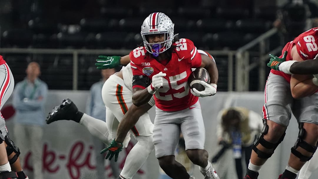 Dec 31, 2025; Arlington, TX, USA; Ohio State Buckeyes running back Bo Jackson (25) carries the ball against the Miami Hurricanes during the second half of 2025 Cotton Bowl and quarterfinal game of the College Football Playoff at AT&T Stadium. Mandatory Credit: Raymond Carlin III-Imagn Images