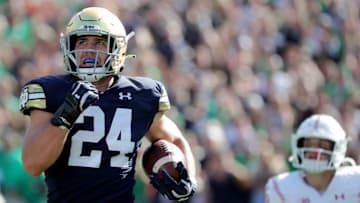 Notre Dame linebacker Jack Kiser (24) returns an interception 66 yards for a touchdown during the fourth quarter of their game Saturday, September 25, 2021 at Soldier Field in Chicago, Ill. Notre Dame beat Wisconsin 41-13.

Uwgrid26 13