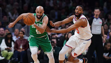 May 7, 2025; Boston, Massachusetts, USA; Boston Celtics guard Derrick White (9) and New York Knicks forward Mikal Bridges (25) work for the ball in the second quarter during game two of the second round for the 2025 NBA Playoffs at TD Garden. Mandatory Credit: David Butler II-Imagn Images