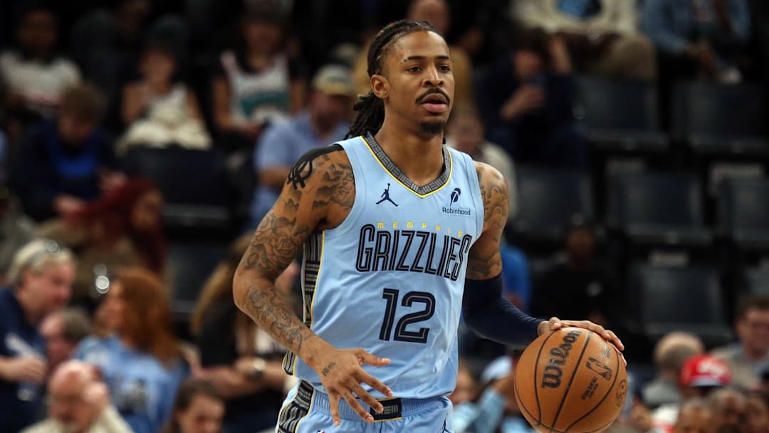 Mar 10, 2025; Memphis, Tennessee, USA; Memphis Grizzlies guard Ja Morant (12) dribbles up the court during the first quarter against the Phoenix Suns at FedExForum. Mandatory Credit: Petre Thomas-Imagn Images