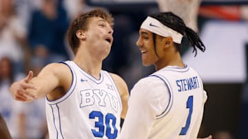Dallin Hall and Trey Stewart celebrate as the Cougars take down West Virginia.