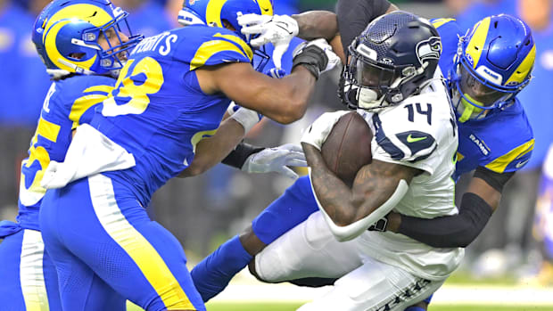 Seattle Seahawks wide receiver DK Metcalf (14) is stopped by the Los Angeles Rams defense.